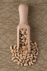 Image showing Wooden scoop with white beans