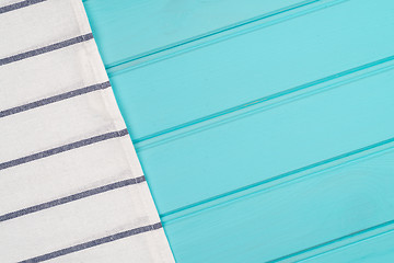 Image showing Blue and white towel over table