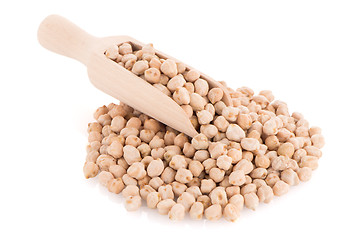 Image showing Uncooked chickpeas and wooden scoop