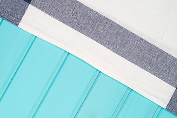 Image showing Blue and white towel over table