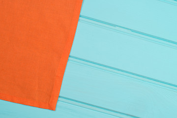 Image showing Orange towel over wooden table