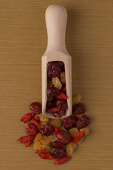 Image showing Wooden scoop with mixed dried fruits