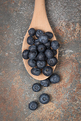 Image showing Blueberries on a wooden spoon