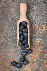 Image showing Blueberries on a wooden spoon