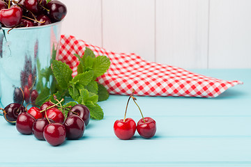 Image showing Cherries in two small metal buckets