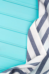 Image showing Blue and white towel over table