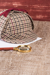 Image showing Paper sheets and magnifying glass