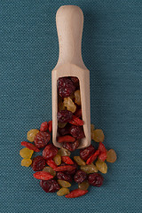 Image showing Wooden scoop with mixed dried fruits