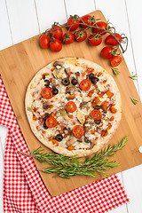 Image showing Pizza with bacon, olives and tomato