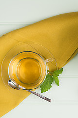 Image showing Herbal tea with melissa in a glass cup