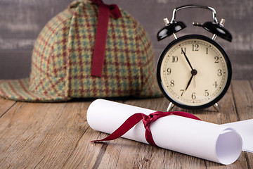 Image showing Wrapped paper sheets and magnifying glass