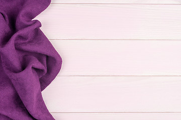 Image showing Purple towel over wooden table