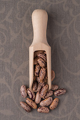 Image showing Wooden scoop with pinto beans