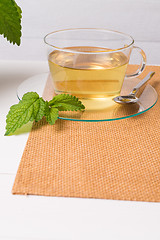 Image showing Herbal tea with melissa in a glass cup