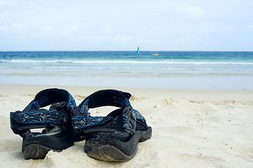 Image showing Sandals on sandy beach

