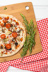 Image showing Pizza with bacon, olives and tomato