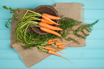 Image showing Carrots on a wooden table