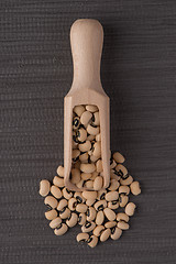 Image showing Wooden scoop with white beans