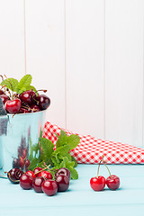 Image showing Cherries in two small metal buckets