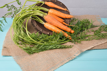 Image showing Carrots on a wooden table