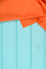 Image showing Orange towel over wooden table