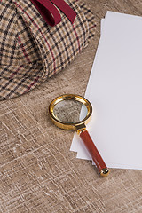 Image showing Paper sheets and magnifying glass