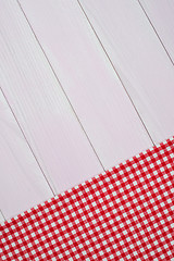 Image showing White and red towel over wooden table