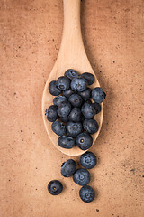 Image showing Blueberries on a wooden spoon