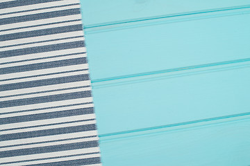 Image showing Blue and white towel over table