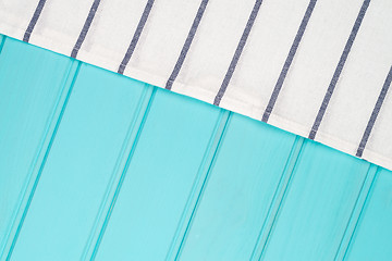 Image showing Blue and white towel over table