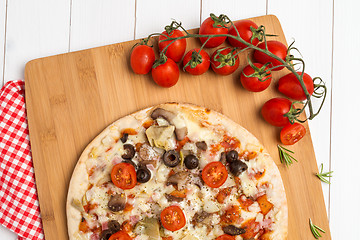 Image showing Pizza with bacon, olives and tomato