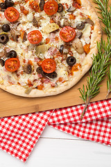 Image showing Pizza with bacon, olives and tomato