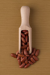 Image showing Wooden scoop with red beans