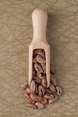 Image showing Wooden scoop with pinto beans