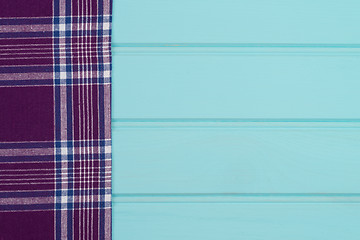 Image showing Purple towel over wooden table