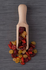 Image showing Wooden scoop with mixed dried fruits