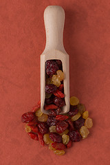 Image showing Wooden scoop with mixed dried fruits