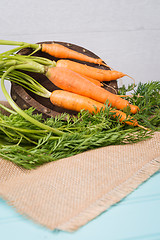 Image showing Carrots on a wooden table