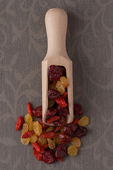 Image showing Wooden scoop with mixed dried fruits