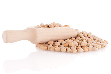 Image showing Uncooked chickpeas and wooden scoop