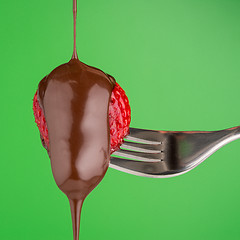 Image showing Strawberry and chocolate on a fork