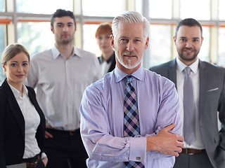 Image showing senior business man with his team at office