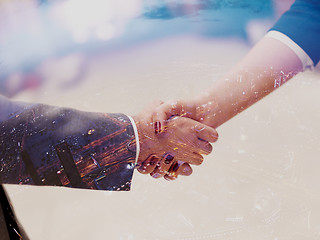 Image showing businesswoman and businessman handshake