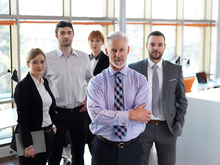 Image showing senior business man with his team at office