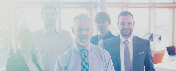 Image showing senior business man with his team at office