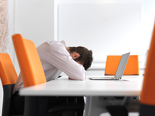 Image showing frustrated young business man at office