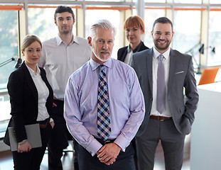 Image showing senior business man with his team at office