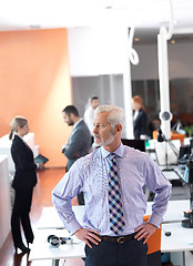 Image showing senior business man with his team at office