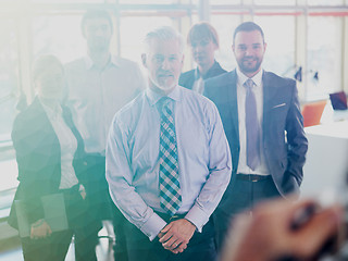 Image showing senior business man with his team at office