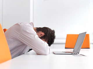 Image showing frustrated young business man at office